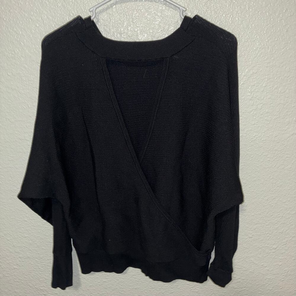 Express Long Sleeve Top Featuring wrap-style front with overlapping design